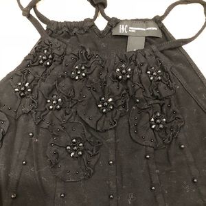 Inc. Black strapped top.